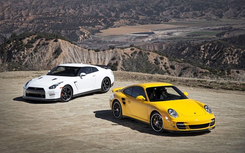 2013 Nissan GT R Black Edition 2012 Porsche 911 Turbo S front three quarters